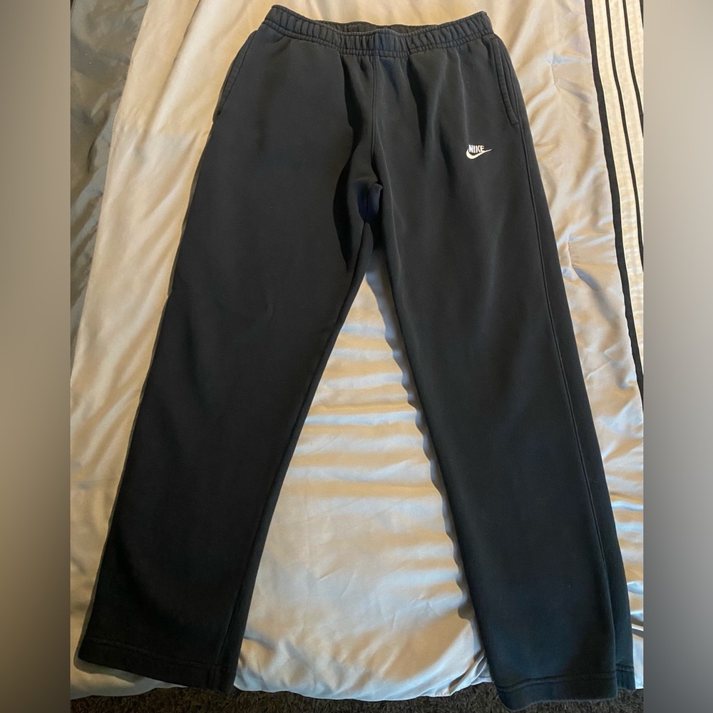 Men’s black Nike sweatpants.